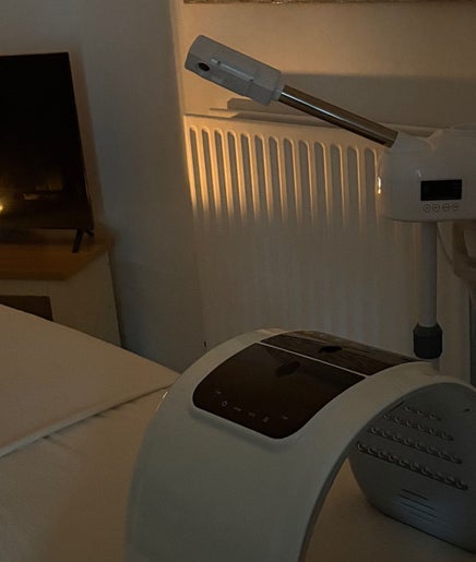 Tranquil treatment room at Spirituellefacials, London, England, GB, with ambient lighting and modern equipment.