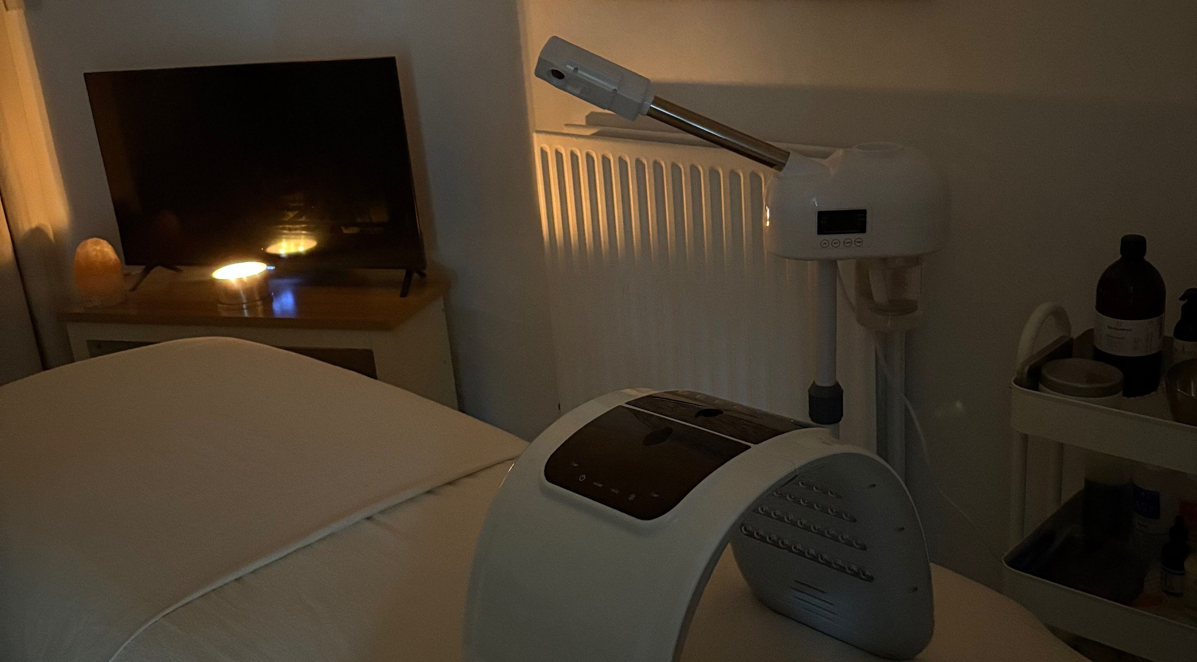 Tranquil treatment room at Spirituellefacials, London, England, GB, with ambient lighting and modern equipment.