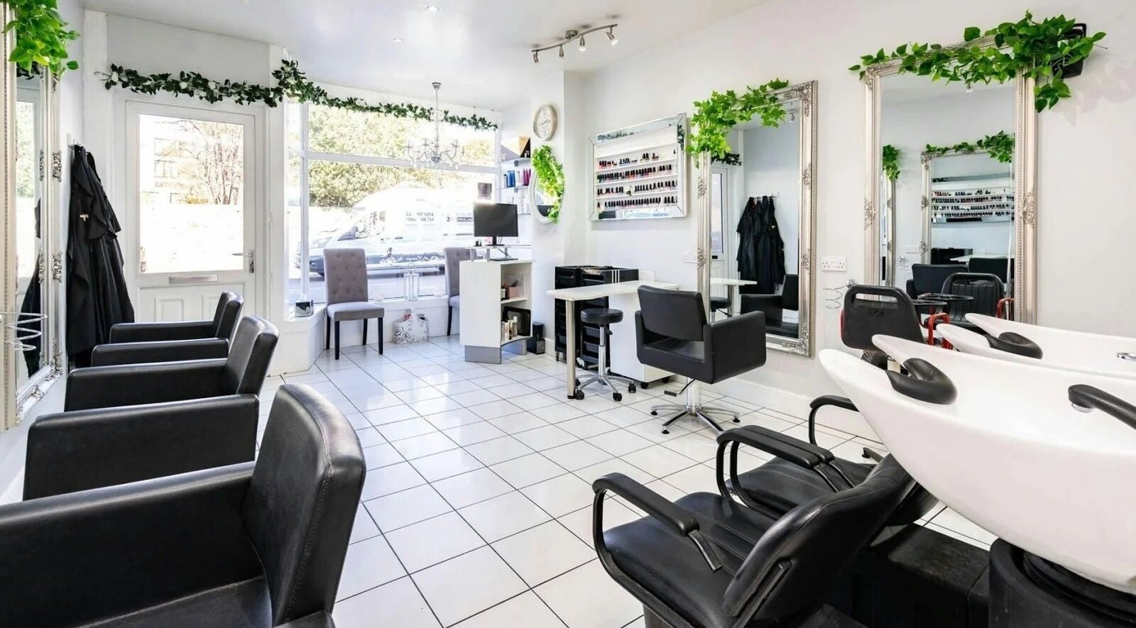 Bright, elegant interior of La Vanya Salon in Edinburgh, Scotland, GB with styling chairs and mirrors.