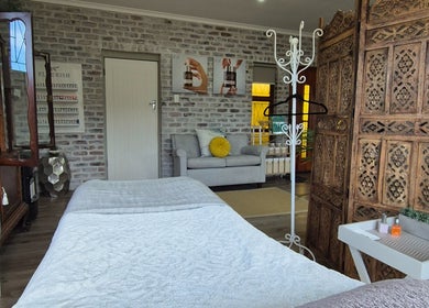 Tranquil treatment room at Flourish Skincare and Beauty Studio, Gqeberha, Eastern Cape, ZA with elegant decor.