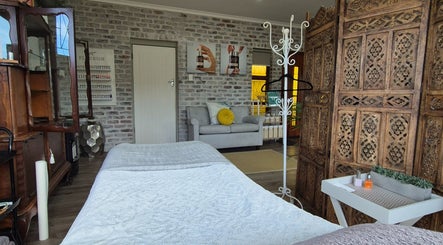 Tranquil treatment room at Flourish Skincare and Beauty Studio, Gqeberha, Eastern Cape, ZA with elegant decor.