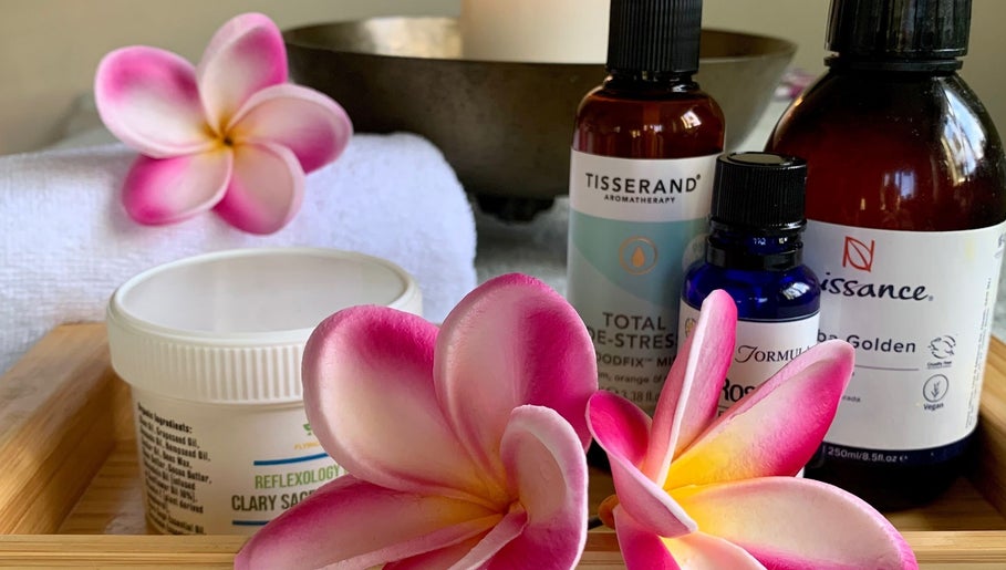 Skincare and aromatherapy products with flowers at Natalie Jane Wellbeing, Malmesbury, England, GB.