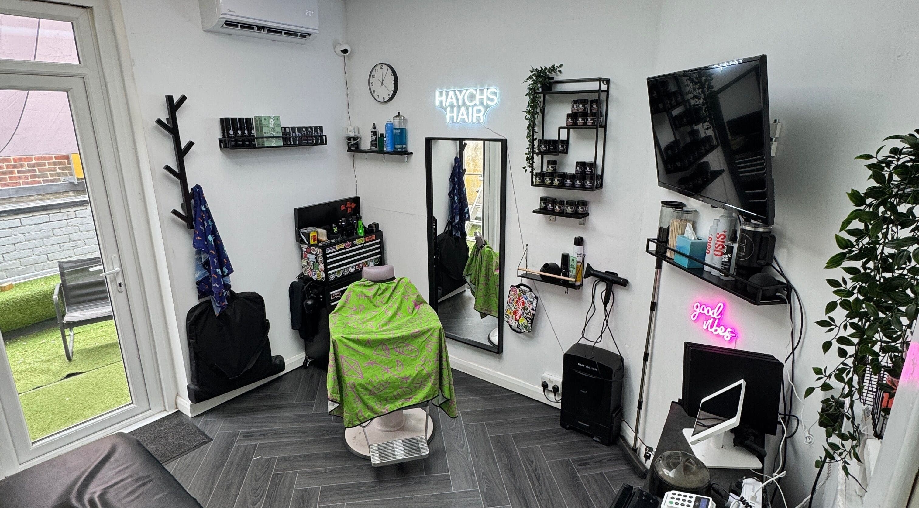 Stylish interior of Haychs Hair, Horsham, England, GB, showcasing modern salon setup and decor.