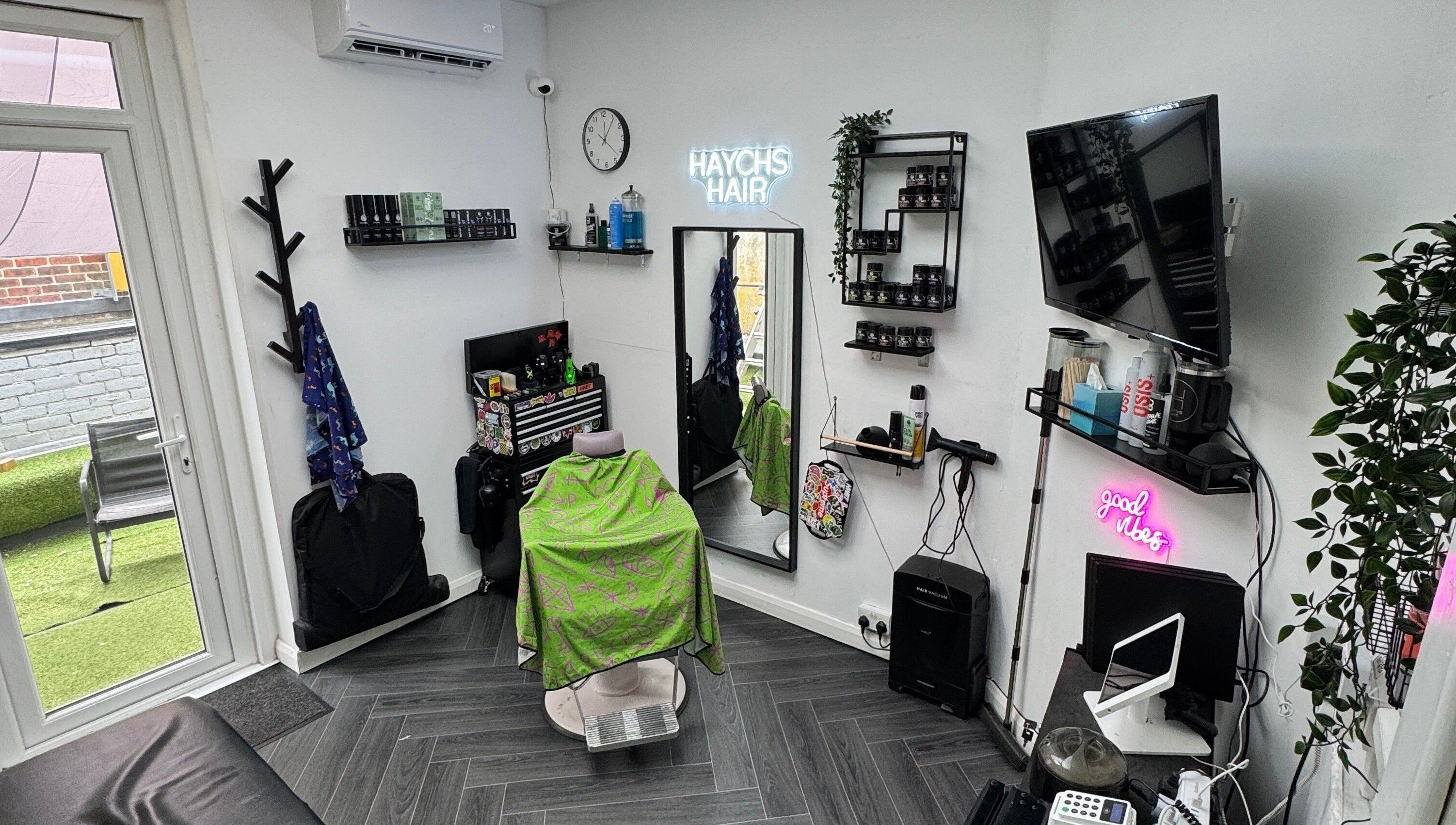 Modern interior of Haychs Hair Barbershop in Horsham, England, GB, featuring stylish decor and professional equipment.