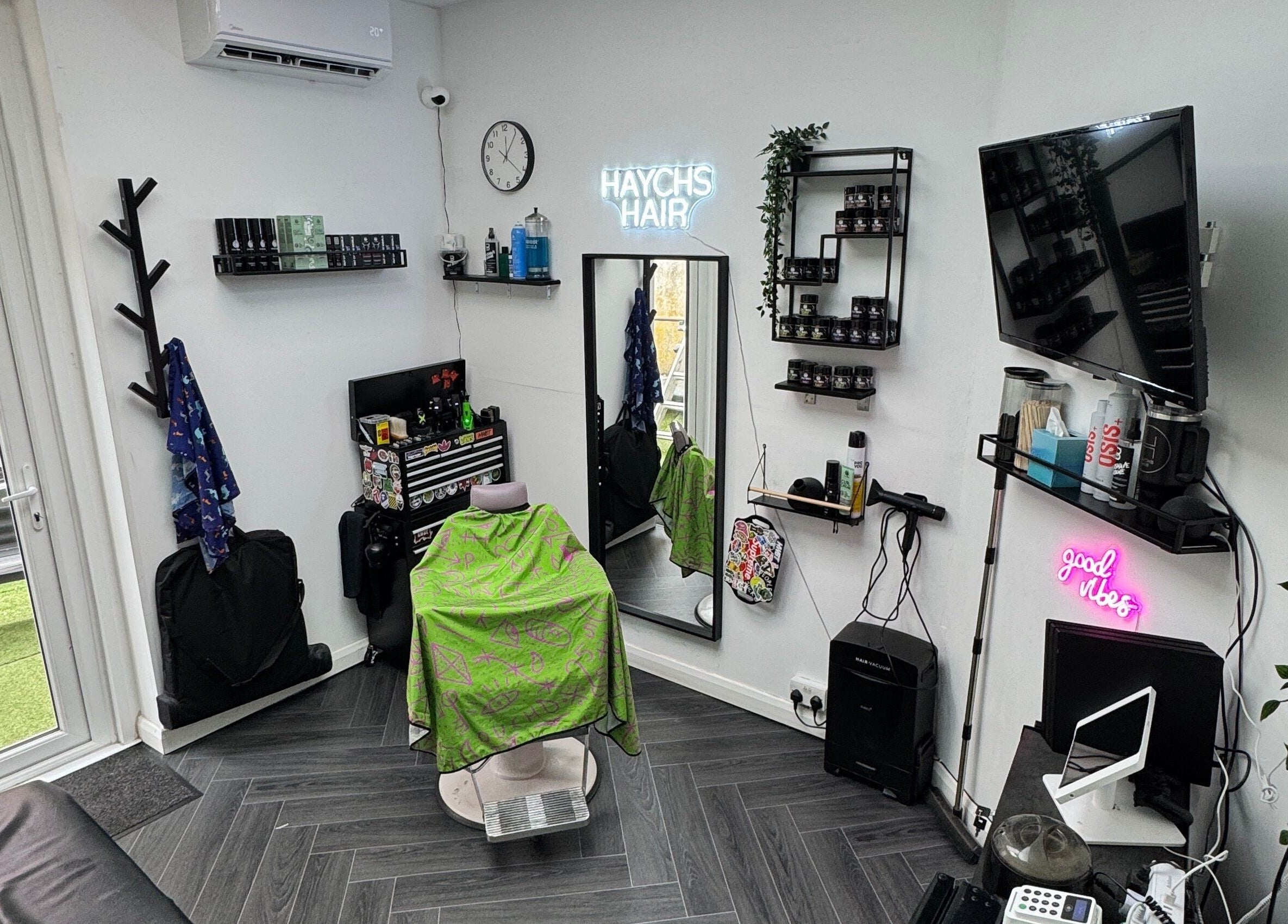 Modern interior of Haychs Hair Barbershop in Horsham, England, GB, featuring stylish decor and professional equipment.