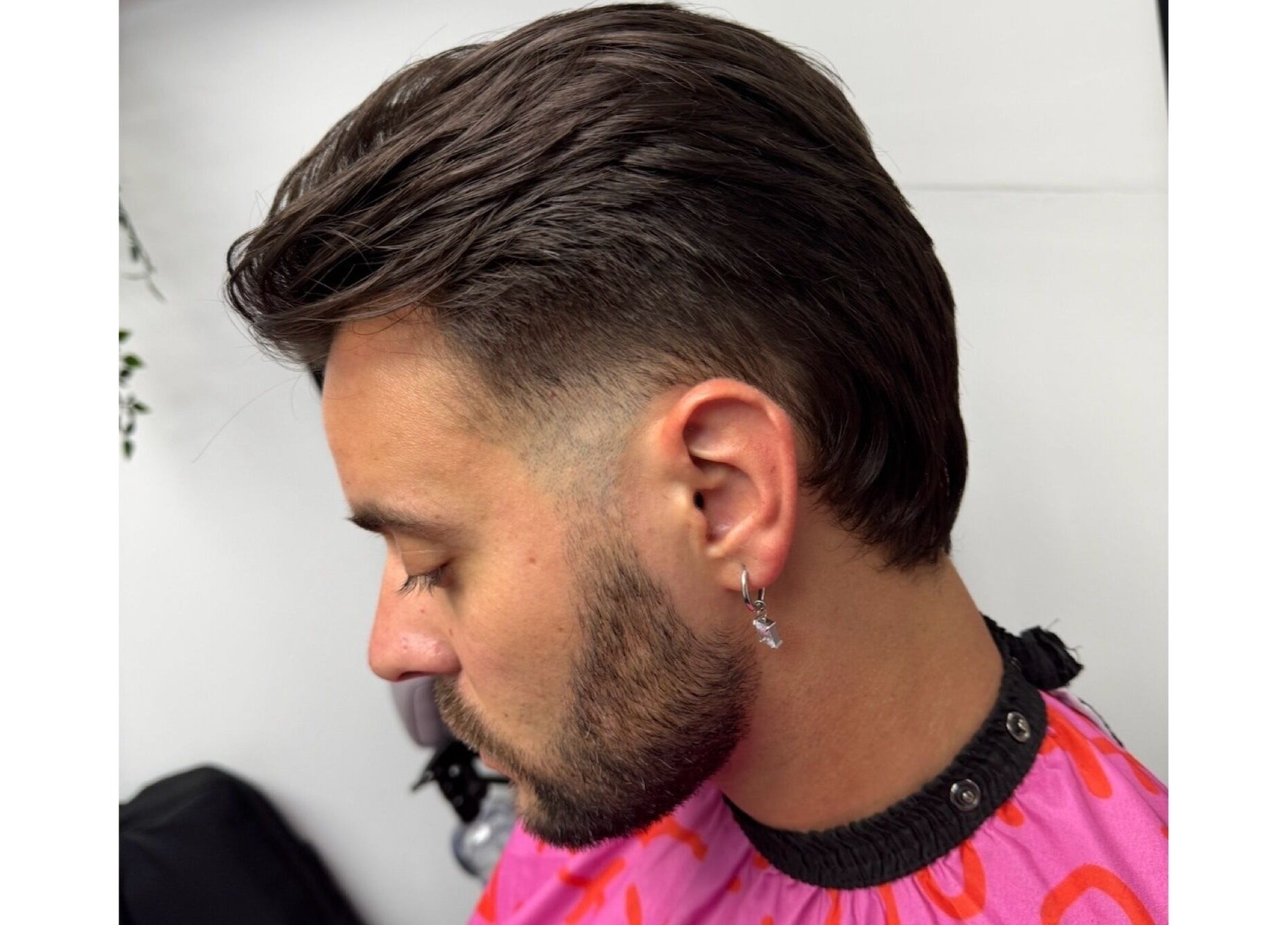 Close-up of a stylish haircut at Haychs Hair Barbershop, Horsham, England, GB, featuring a neat fade.