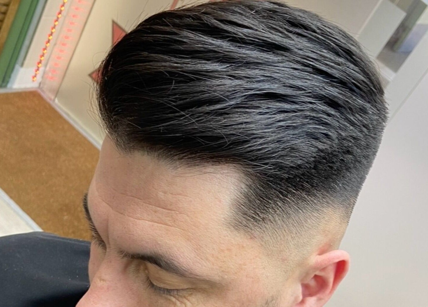 Close-up of a sleek haircut with fade at Haychs Hair Barbershop, Horsham, England, GB.