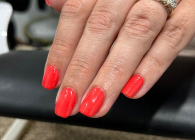 Vibrant coral nails at Nails By Georgie at Sacred Empire, Royal Tunbridge Wells, England, GB.