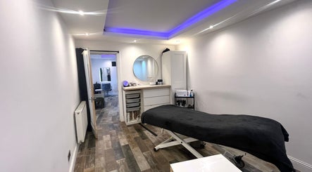 Relaxing treatment room at The Beauty Stop, Edinburgh, Scotland, GB, featuring a massage bed and calming decor.