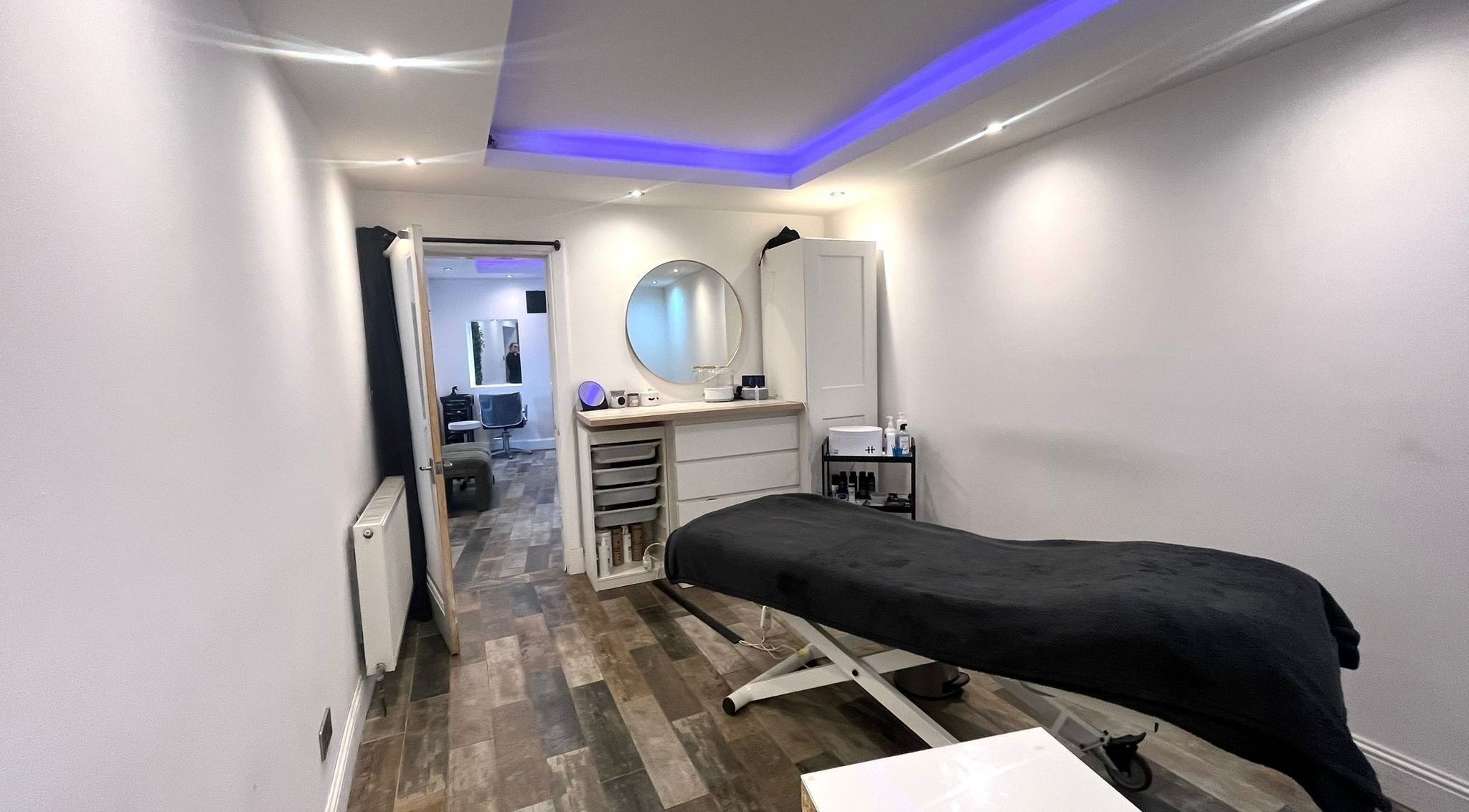 Relaxing treatment room at The Beauty Stop, Edinburgh, Scotland, GB, featuring a massage bed and calming decor.
