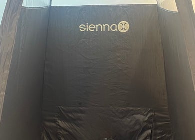 Sienna X tanning booth at The Beauty Stop, Edinburgh, Scotland, GB, offering professional spray tanning.