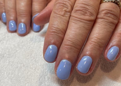 Lavender manicured nails at The Beauty Stop, Edinburgh, Scotland, GB, showcasing elegant nail care.