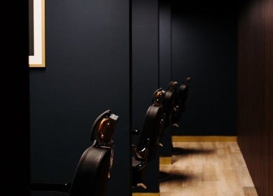 Stylish barber chairs in a sleek setting at Antonio's Signature Mriehel, Birkirkara, MT.