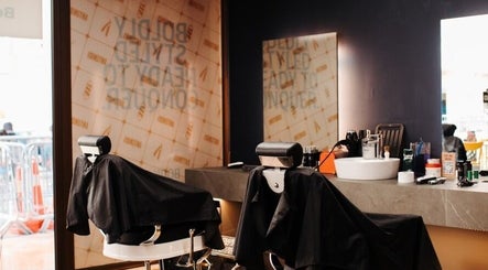 Sleek barber chairs at Antonio's Swift Cuts Campus Hub in Msida, MT, ready for styling sessions.