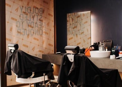 Modern styling chairs and mirrors at Antonio's Swift Cuts Campus Hub in Msida, MT.