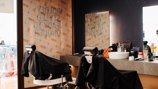 Modern styling chairs and mirrors at Antonio's Swift Cuts Campus Hub in Msida, MT.