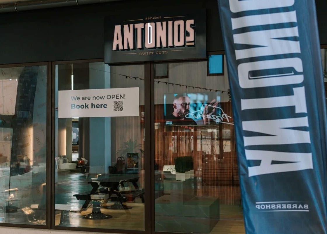 Exterior view of Antonio's Swift Cuts Campus Hub, Msida, MT with open sign and modern design.