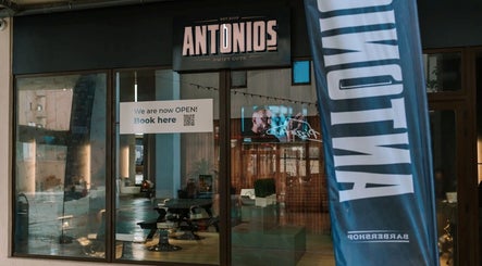 Exterior view of Antonio's Swift Cuts Campus Hub, Msida, MT with open sign and modern design.