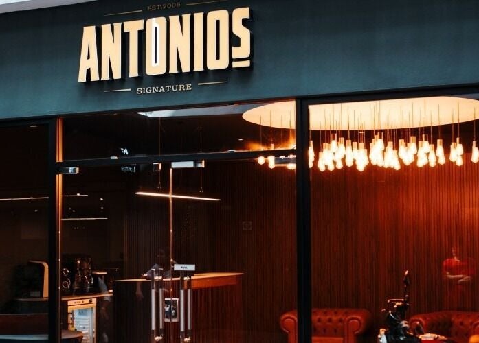Outside view of Antonio's Signature Mriehel in Birkirkara, MT with modern lighting and plush seating.