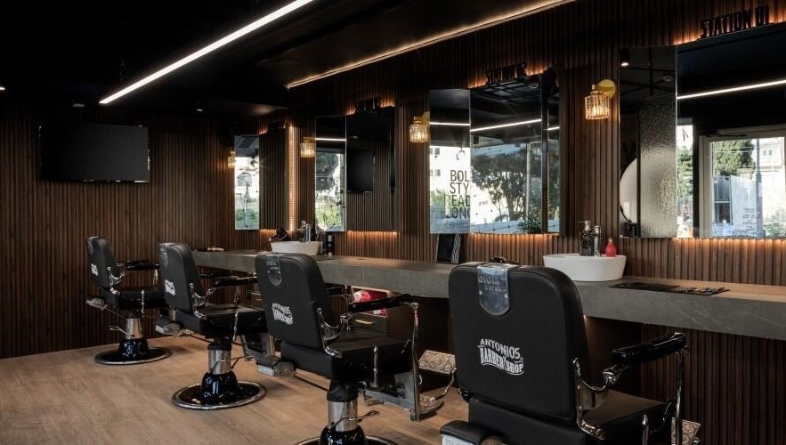 Interior of Antonio's Barbershop Spinola Park, San Ġiljan, MT with modern barber chairs and mirrors.