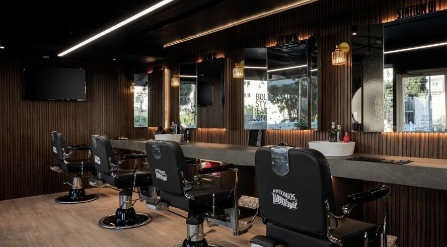 Interior of Antonio's Barbershop Spinola Park, San Ġiljan, MT with modern barber chairs and mirrors.