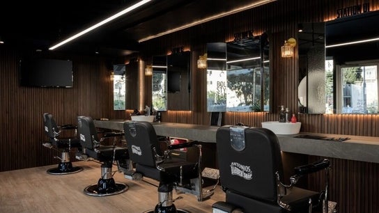 Interior of Antonio's Barbershop Spinola Park, San Ġiljan, MT with modern barber chairs and mirrors.