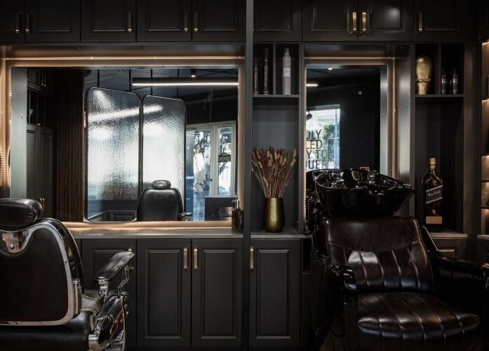 Luxurious black leather chairs in Antonio's Barbershop Spinola Park, San Ġiljan, MT.