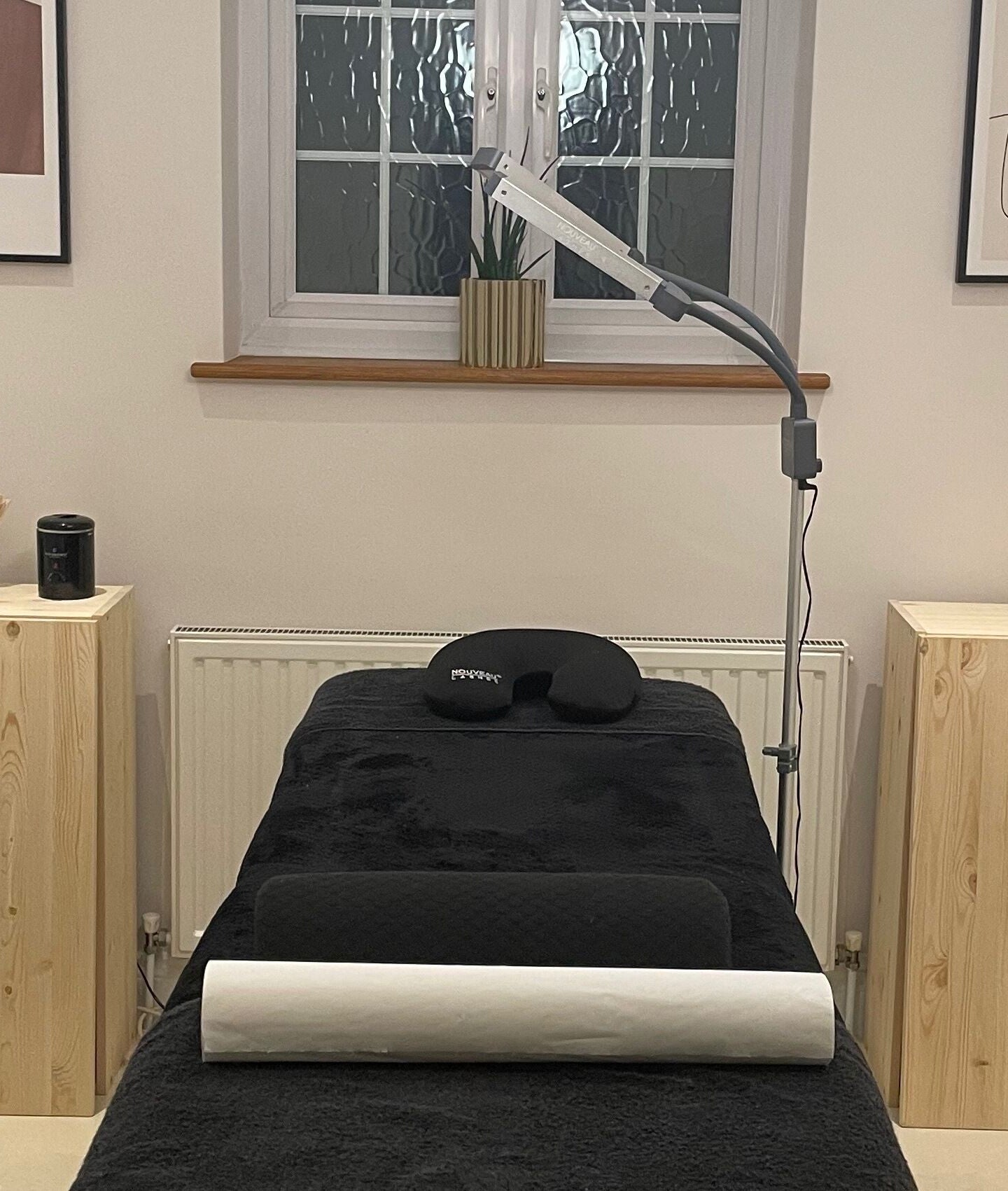 Pluck'd Chelmsford treatment room in Chelmsford, England, GB, featuring a cozy massage bed and stylish decor.