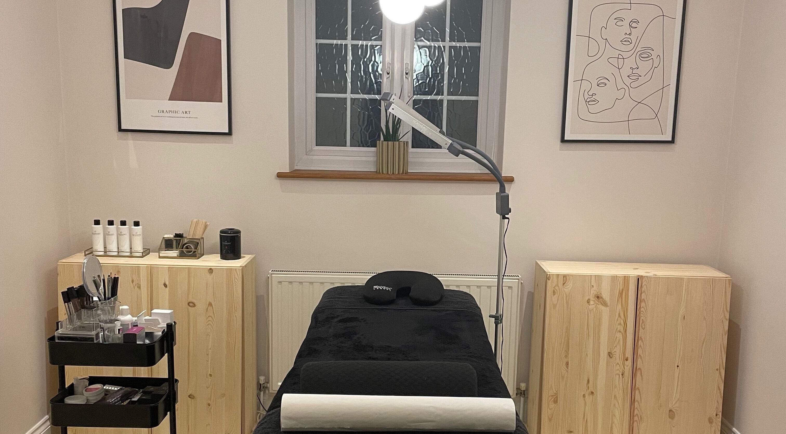 Tranquil treatment room at Pluck’d Hornchurch, Hornchurch, England, GB, featuring minimalist decor and comfortable bed.