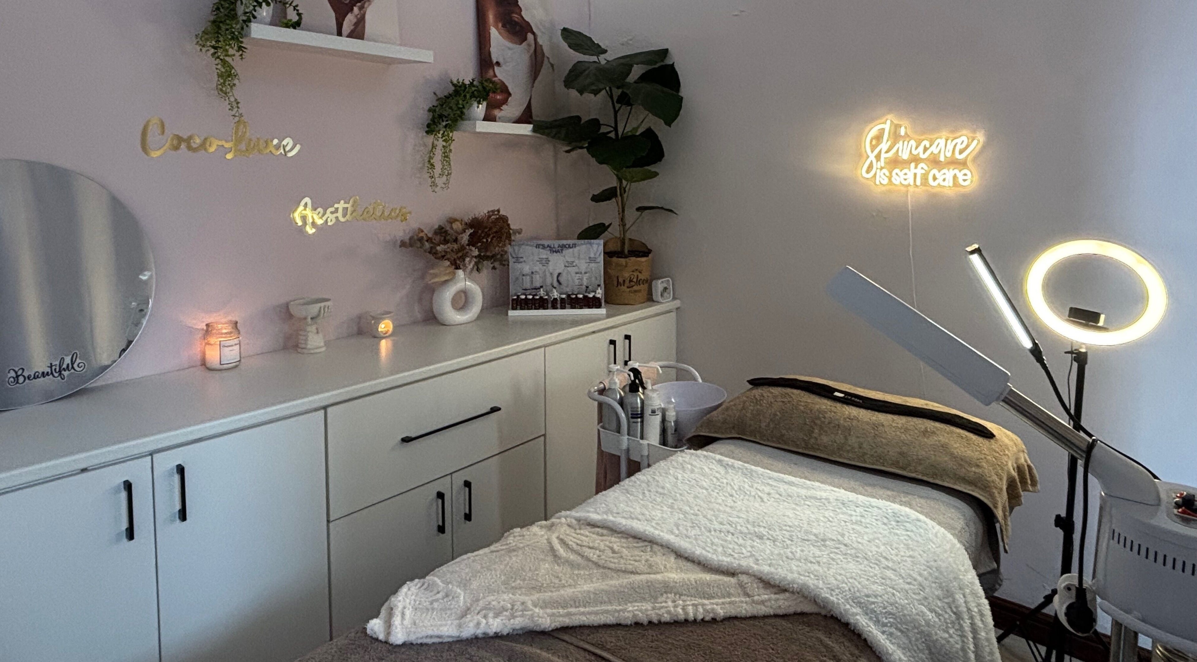 Cozy skincare room at Coco Luxe Skin Aesthetics, Cape Town, Western Cape, ZA with soft lighting and aesthetic decor.