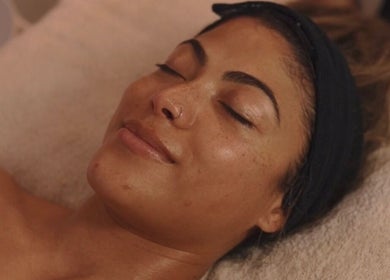 Woman enjoying facial at Coco Luxe Skin Aesthetics, Cape Town, Western Cape, ZA.