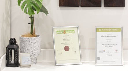 Diplomas and plant at MRL Massage & Myo Therapy, Melbourne, Victoria, AU.