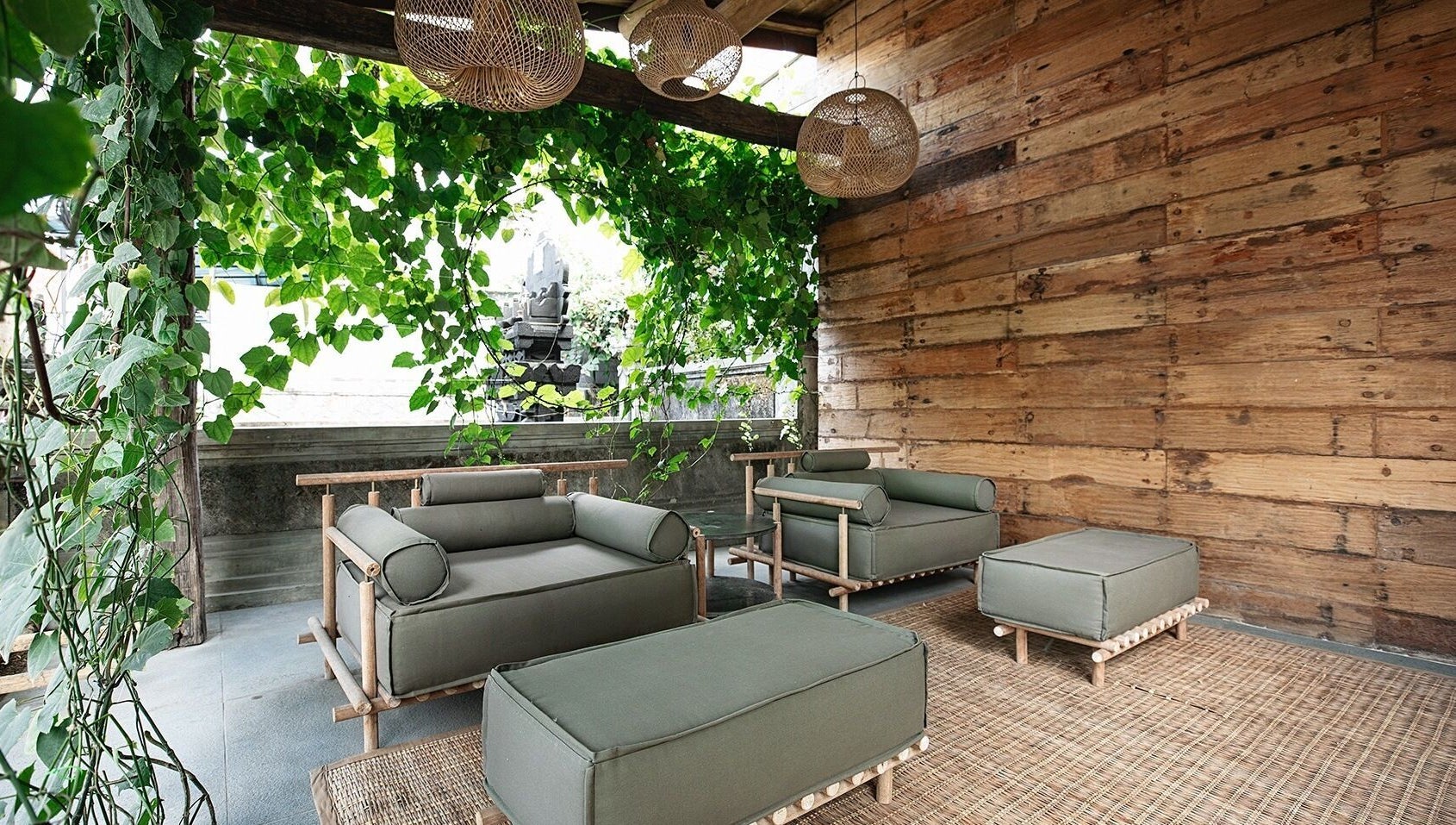 Tranquil lounge area at Shosan Holistic Spa, Bali, Bali, ID, featuring lush greenery and rustic decor.