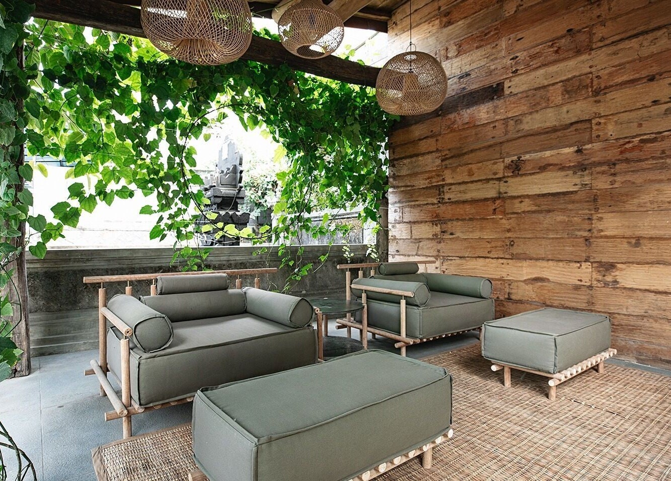 Tranquil lounge area at Shosan Holistic Spa, Bali, Bali, ID, featuring lush greenery and rustic decor.
