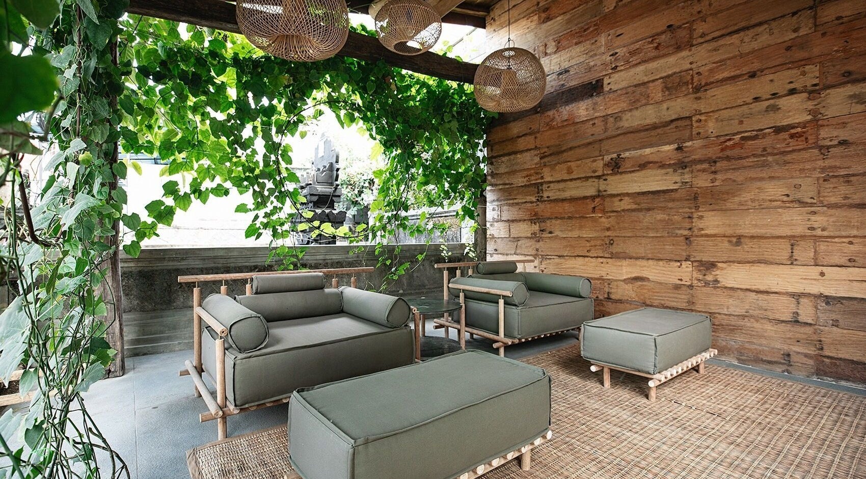 Tranquil lounge area at Shosan Holistic Spa, Bali, Bali, ID, featuring lush greenery and rustic decor.
