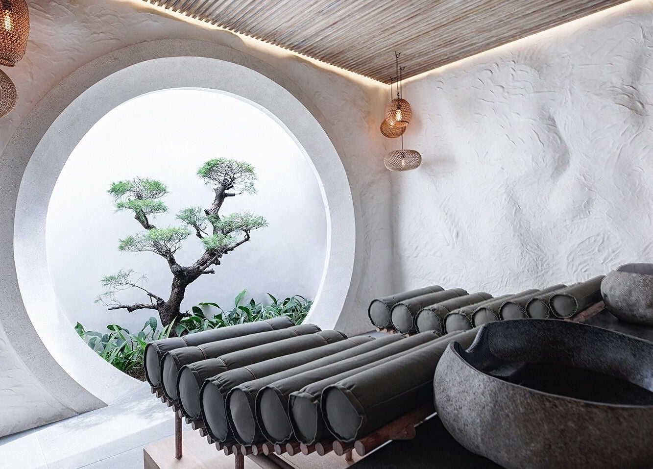 Zen garden massage room at Shosan Holistic Spa, Bali, Bali, ID with circular window and natural decor.