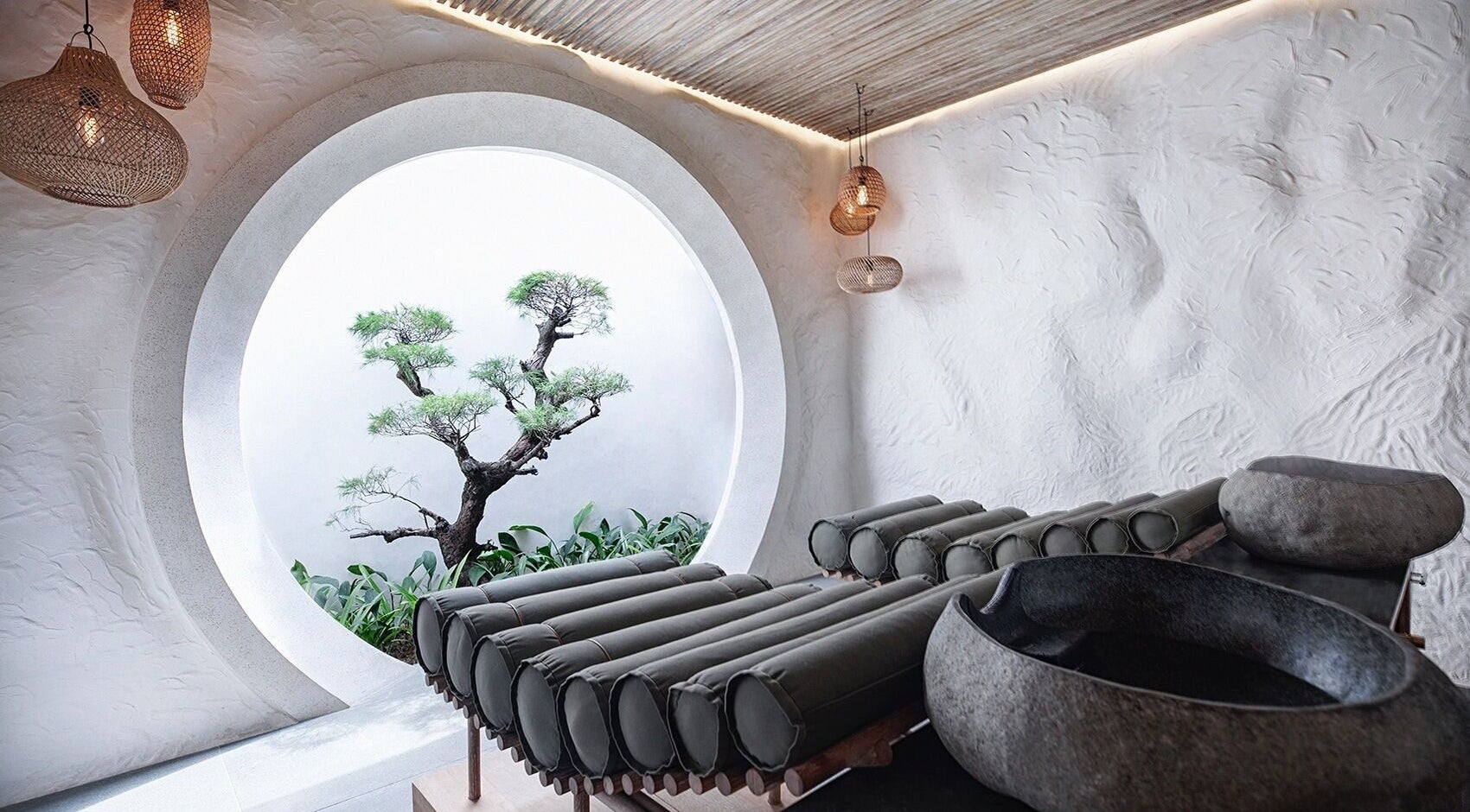 Zen garden massage room at Shosan Holistic Spa, Bali, Bali, ID with circular window and natural decor.