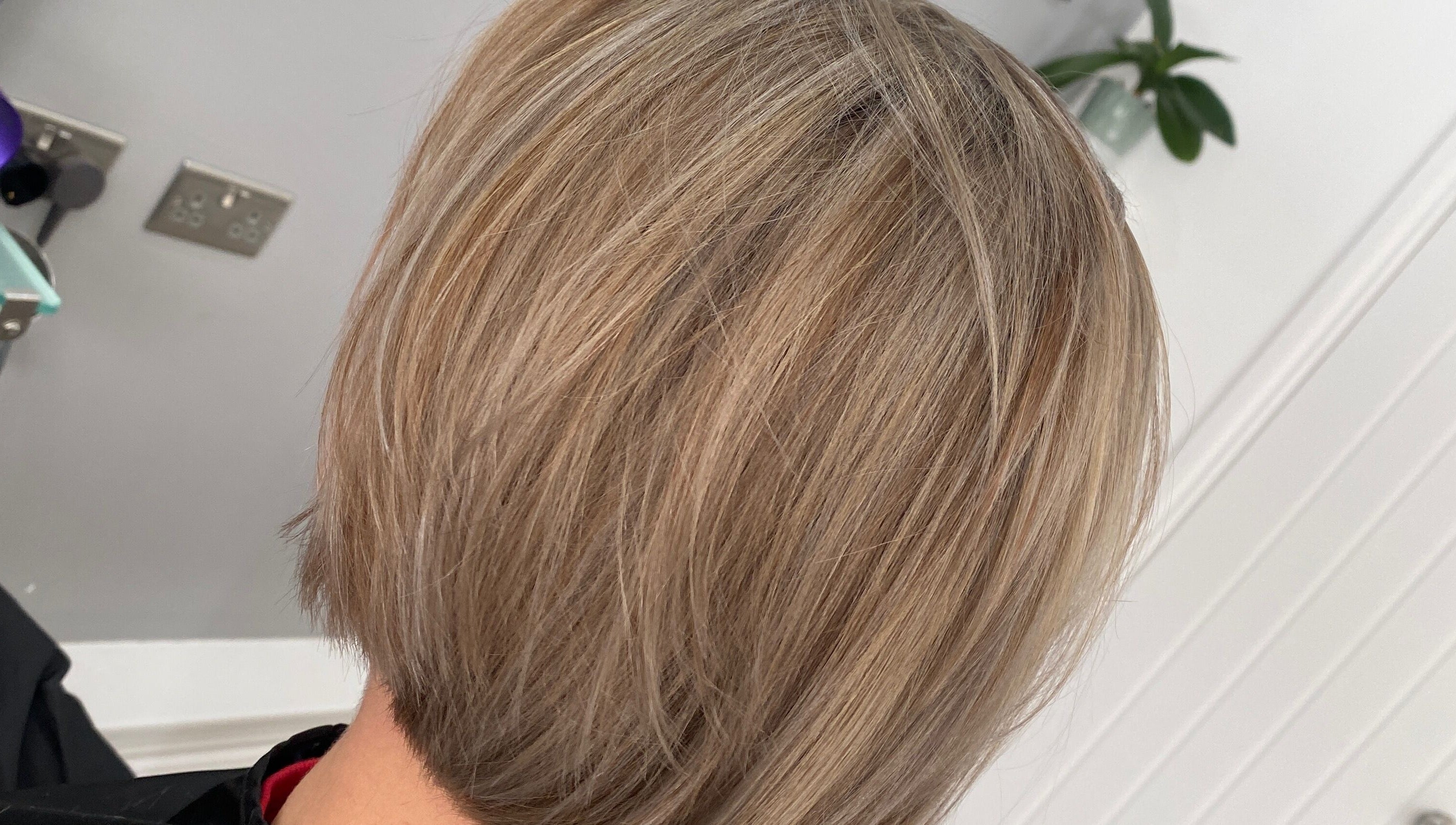 Stylish blonde bob cut at HairMatters by Mariana, Feltham, England, GB. Perfectly layered for a sleek finish.