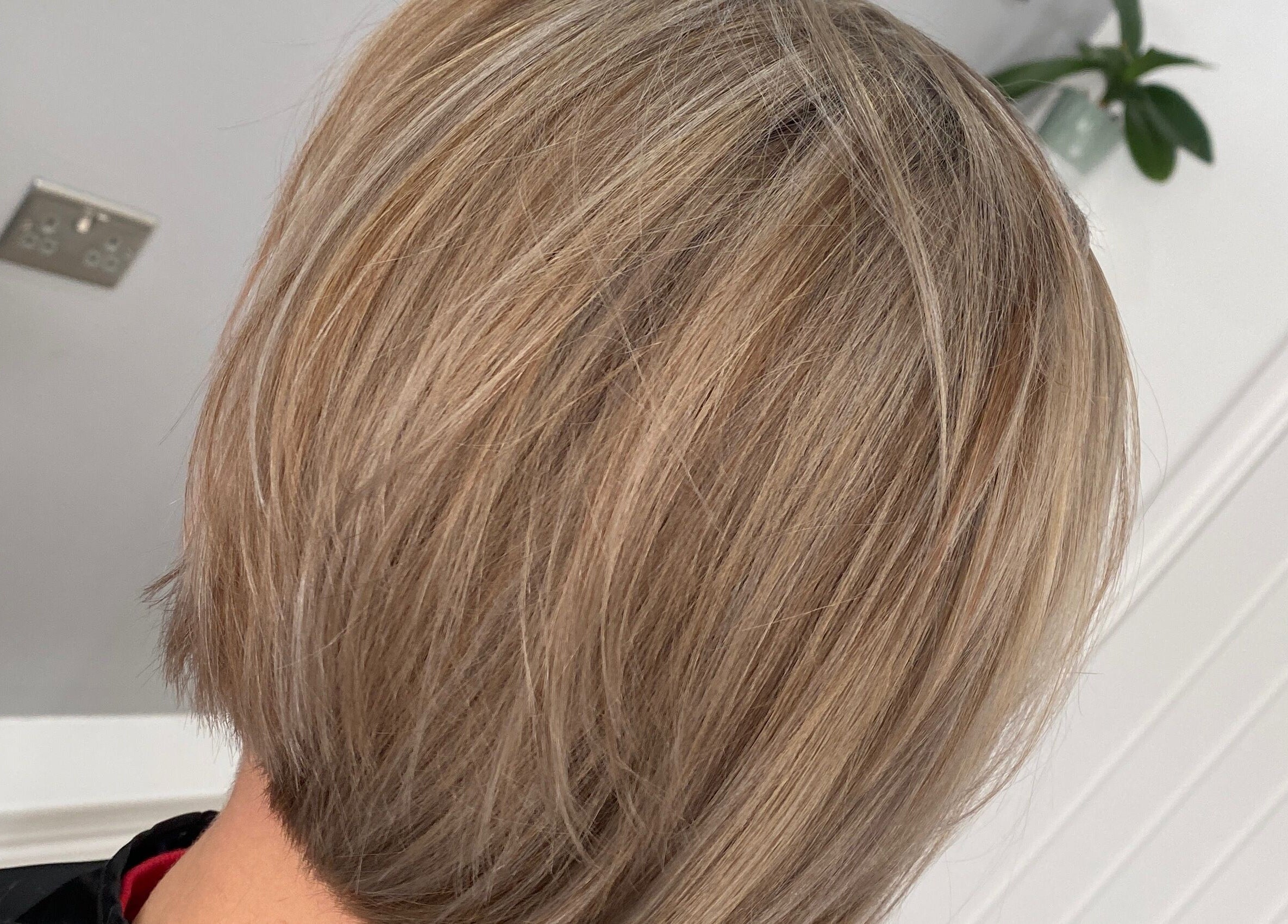 Stylish blonde bob cut at HairMatters by Mariana, Feltham, England, GB. Perfectly layered for a sleek finish.