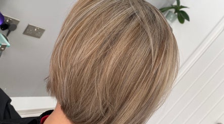 Stylish blonde bob cut at HairMatters by Mariana, Feltham, England, GB. Perfectly layered for a sleek finish.