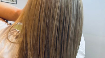 Long, straight, glossy hair showcased at HairMatters by Mariana, Feltham, England, GB.