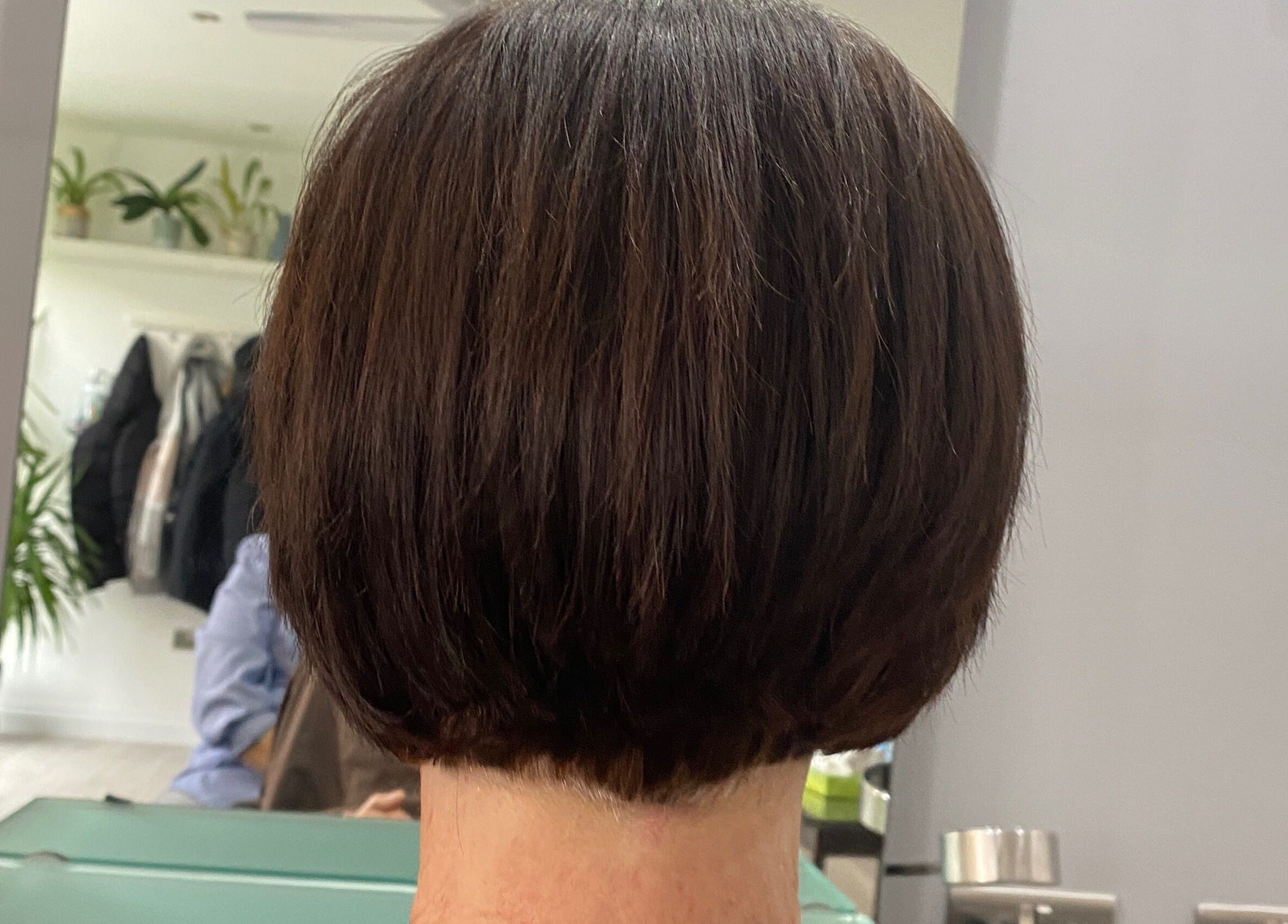 Stylish bob haircut reflected in mirror at HairMatters by Mariana, Feltham, England, GB.