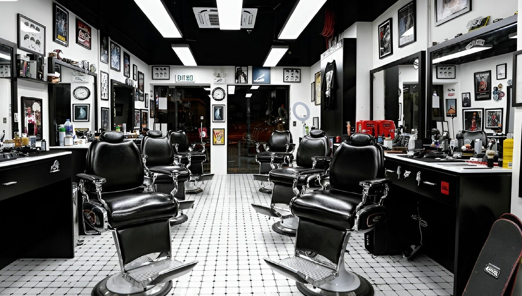 Interior of EAGLES BARBER SHOP in 九龍, 九龍, HK with stylish black barber chairs and modern decor.