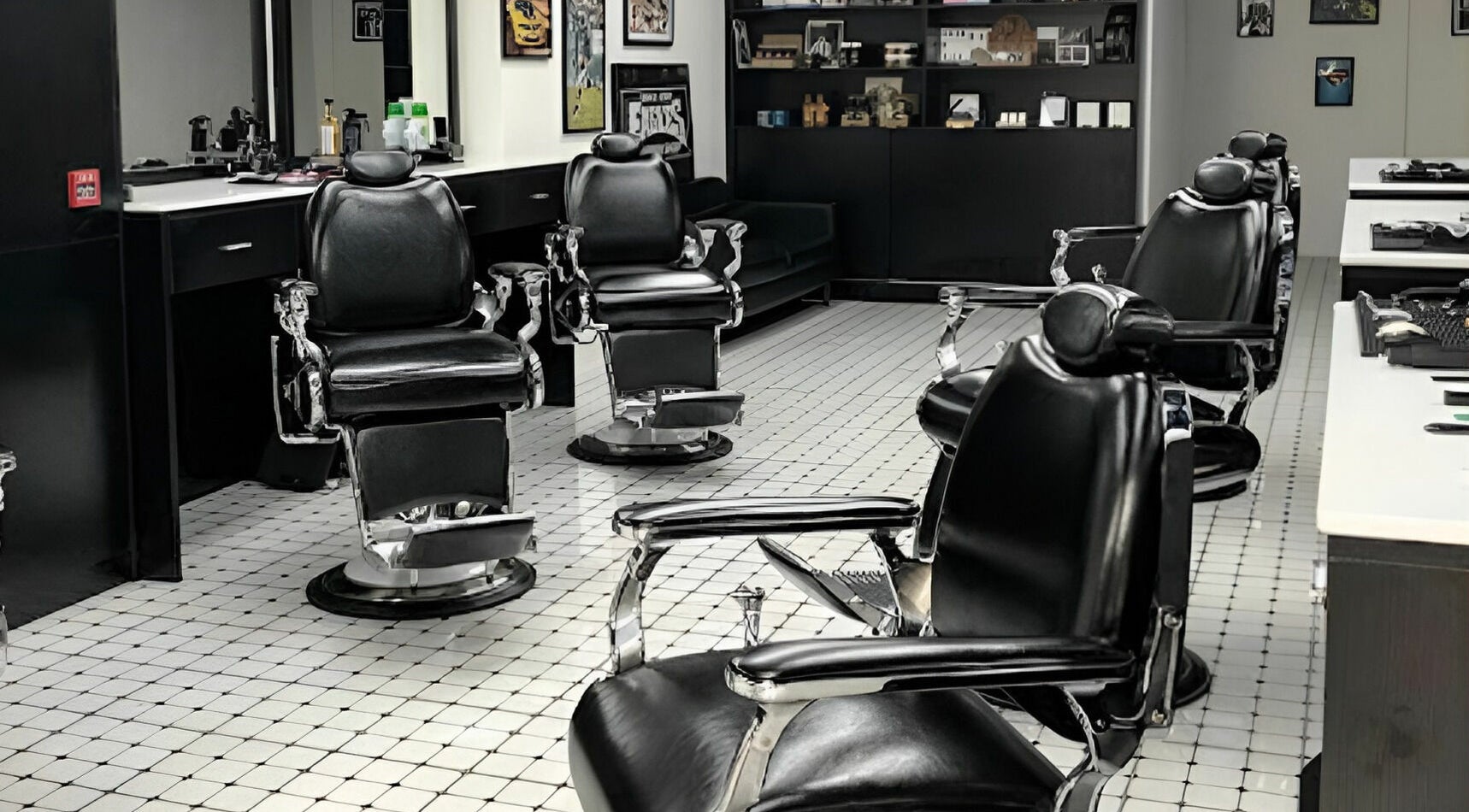 Modern interior of EAGLES BARBER SHOP in 九龍, 九龍, HK with sleek black chairs and stylish decor.