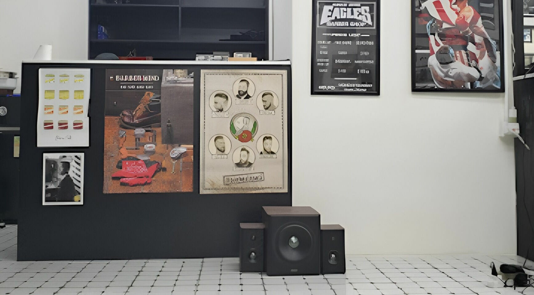 Interior wall with stylish posters at EAGLES BARBER SHOP, 九龍, 九龍, HK showcasing modern barber art.