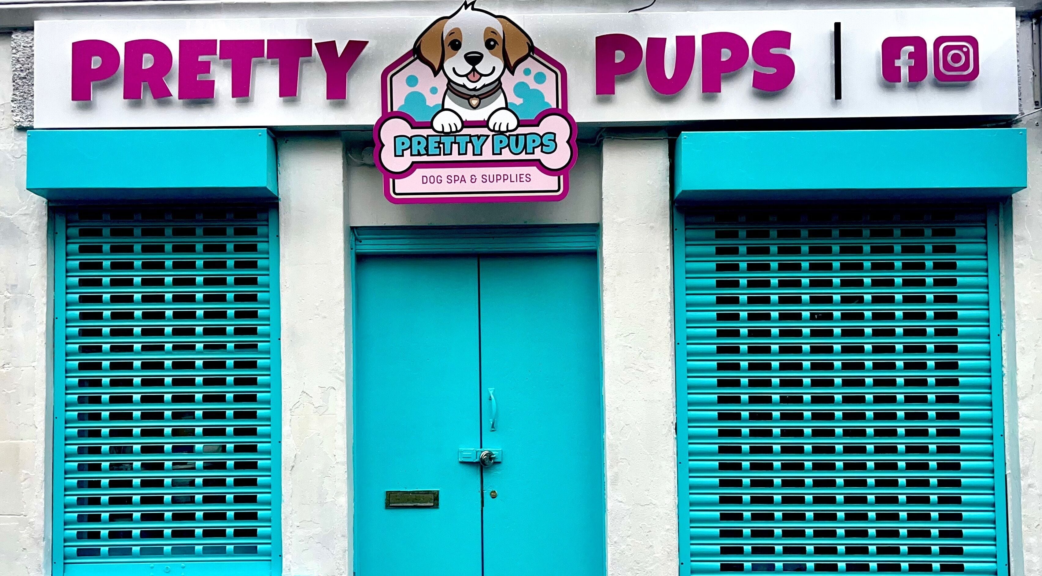 Pretty Pups Dog Spa entrance with bright teal shutters in Gourock, Scotland, GB.