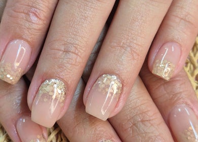 Elegant gold-tipped nails from Radiant Blossom - Pretoria North, located in Pretoria, Gauteng, ZA.
