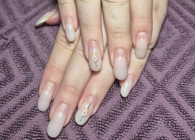 Elegant floral nail art on hands at Radiant Blossom - Pretoria North, Pretoria, Gauteng, ZA.