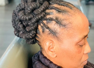 Stylish braided updo at Entlestylist in East London, Eastern Cape, ZA.