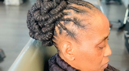 Stylish braided updo at Entlestylist in East London, Eastern Cape, ZA.